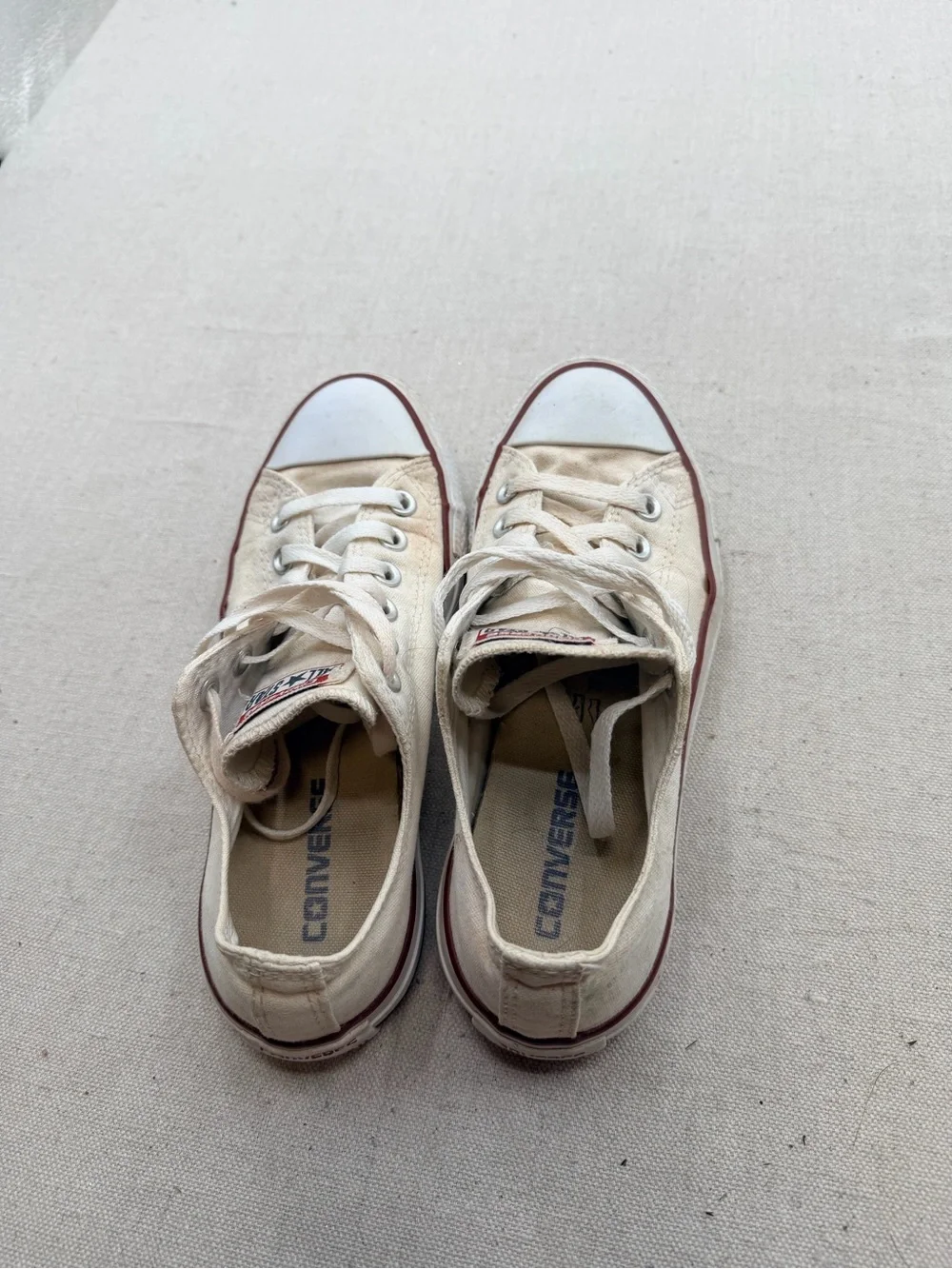 Converse Low Top Sneakers in Cream with Red Trim